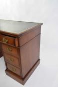 Late Victorian American walnut twin pedestal desk, the top with black rexine writing surface and