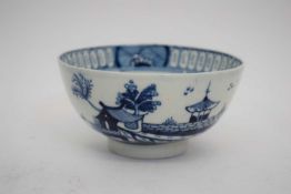Lowestoft tea bowl circa 1780 with blue and white design of pagoda and island scene verso