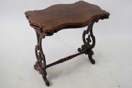 Victorian walnut veneered shaped centre table with pierced end supports and central turned