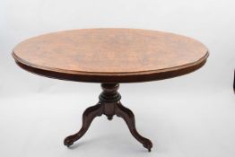 Victorian burr walnut veneered oval top loo table raised on a turned column with tripod base,