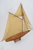 20th century good quality model yacht and accompanying stand, apparently unsigned, 9cm max