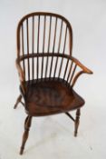 Good quality elm seated Windsor chair with stick back over a saddle seat raised on turned legs