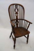 19th century elm seated Windsor chair with stick and splat back raised on turned legs with H-