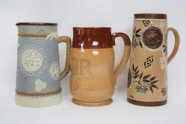 Group of three Doulton ware jugs including one made for Philips Oxford Street commemorating the