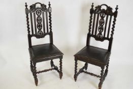 Pair of Victorian Gothic oak chairs with barley twist supports and upholstered seat