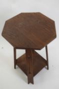 Late 19th century oak octagonal top table in the Arts & Crafts style with pierced legs and a base