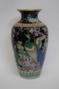 Chinese porcelain famille noir vase decorated in polychrome with exotic birds amongst flowers,