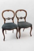 Pair of Victorian mahogany framed balloon back dining chairs with upholstered seats, serpentine