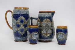 Large Doulton ware jug together with a further jug and two beakers, all with similar shell type
