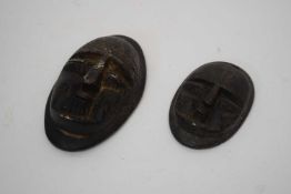 Two wooden tribal carvings of heads