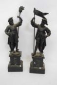 Pair of spelter European figures of courtiers holding pennants, mounted on square bases and