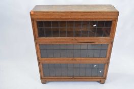 Oak lead glazed Globe Wernicke three tier bookcase, 85cm wide