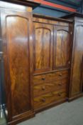 Victorian mahogany turret wardrobe with two full length side doors, centre section with two short