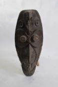 Tribal/ethnographica interest - Papua New Guinea mask of anthropomorphic form, the oval face set