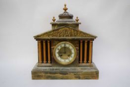 Late 19th century onyx cased mantel clock with enamelled dial with Arabic numerals to a brass twin