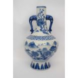 Modern Chinese porcelain vase with blue and white design of mountains within Ming style borders