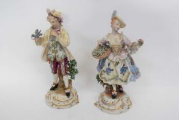 Pair of Capo di Monte or Naples porcelain figures of ladies on gilt scroll bases (2)