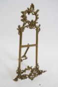 Small brass table easel with foliate decoration