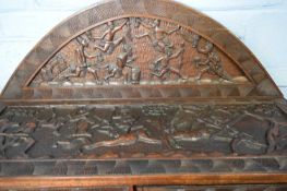 20th century West African hardwood sideboard, profusely carved with figures, hunting scene, and