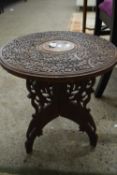 SMALL SOUTH EAST ASIAN CIRCULAR HARDWOOD TABLE WITH THREE LEG BASE, DECORATED WITH SPRAYS OF FLOWERS