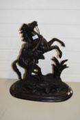 LARGE BRONZED SPELTER MARLEY HORSE MODEL SET ON AN EBONISED WOODEN BASE