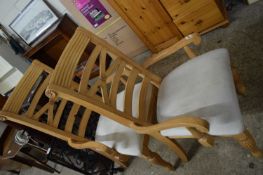 PAIR OF MODERN LIGHT WOOD FRAMED CARVER CHAIRS WITH CREAM UPHOLSTERED SEATS