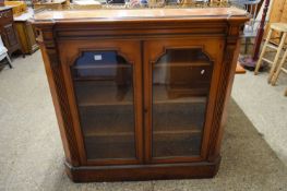 VICTORIAN AMERICAN WALNUT BOOKCASE CABINET, THE TOP WITH BRASS GALLERY OVER A BODY WITH TWO GLAZED