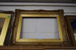 GILT FOLIATE MOULDED PICTURE FRAME, 64CM WIDE
