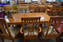 MODERN YEW WOOD VENEERED TWIN PEDESTAL EXTENDING DINING TABLE TOGETHER WITH SIX FLORAL UPHOLSTERED