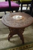 SMALL SOUTH EAST ASIAN CIRCULAR HARDWOOD TABLE WITH THREE LEG BASE, DECORATED WITH SPRAYS OF