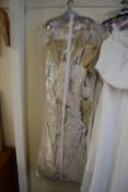 WEDDING DRESS IN POLYTHENE BAG