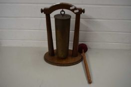 BRASS SHELL CASE FORMED AS A DINNER GONG WITH STRIKER AND STAND
