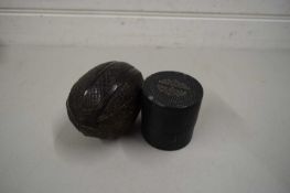 CASED MEASURING GLASS AND A CARVED NUT (2)