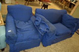SMALL BLUE TWO-SEATER SOFA WITH LOOSE COVERS AND ACCOMPANYING ARMCHAIR (2)