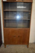 EARLY 20TH CENTURY OAK BOOKCASE CABINET WITH SLIDING GLASS DOORS OVER A CUPBOARD BASE, 137CM WIDE