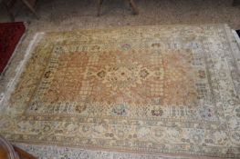 20TH CENTURY WOOL FLOOR RUG DECORATED WITH STYLISED FLOWERS ON A BEIGE BACKGROUND, 210CM WIDE