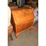 WALNUT VENEERED THREE DRAWER BUREAU