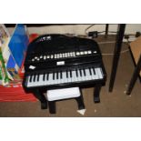 CHILD'S MINIATURE ELECTRIC PIANO