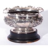 An early 20th century silver plated rose bowl of oval form decorated with stylised floral detail and