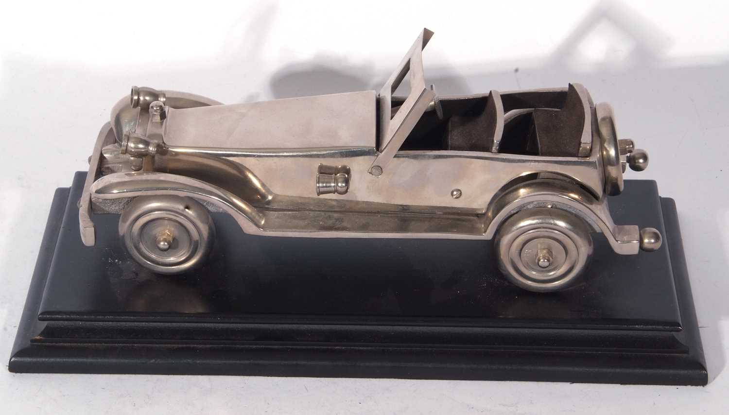 Cast metal model of a open topped vintage sports car set on an ebonised plinth base, the base 35cm - Image 2 of 5