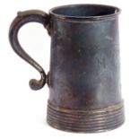Heavy George VI silver tankard of tapering cylindrical form with loop handle and reeded base,
