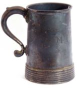 Heavy George VI silver tankard of tapering cylindrical form with loop handle and reeded base,