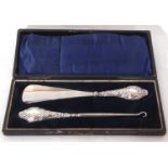 Cased George V embossed silver handled shoe horn and button hook, Chester 1913, maker's marks