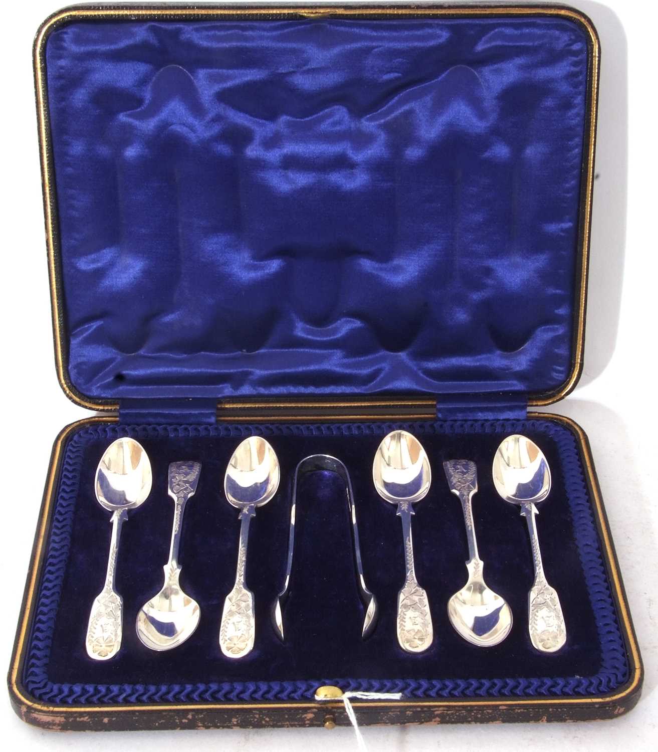 Cased set of six Edward VII silver coffee spoons with bright cut foliate decoration to the stems and