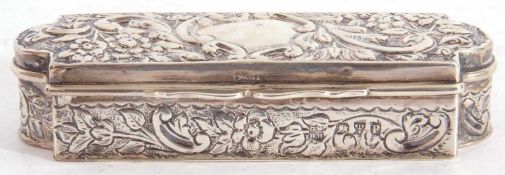 Victorian trinket box of shaped rectangular form, the lid elaborately embossed with floral