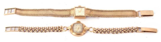 Ladies import hallmarked 9ct gold cased wrist watch with gold hands to a silvered dial with raised