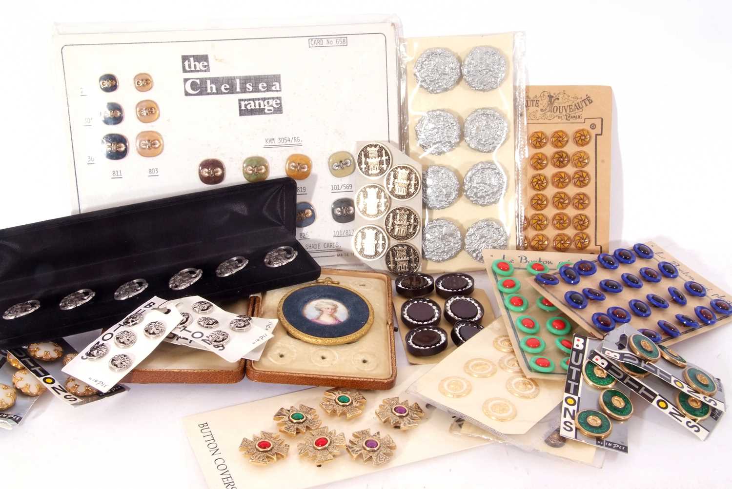 Box of various vintage and modern buttons