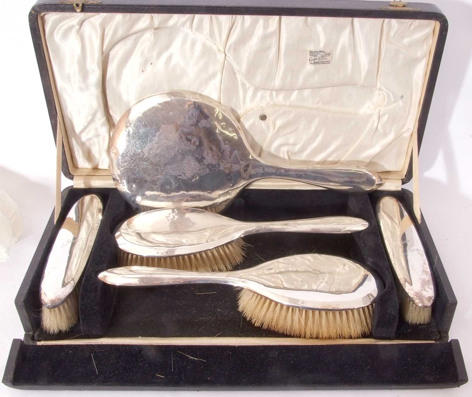 Cased George V silver backed dressing table set of plain design, each item with autograph