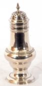 George III silver caster of baluster form, plain polished design and pull off pierced lid with an