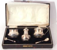 George V cased three piece condiment set of compressed circular form comprising mustard, liner and